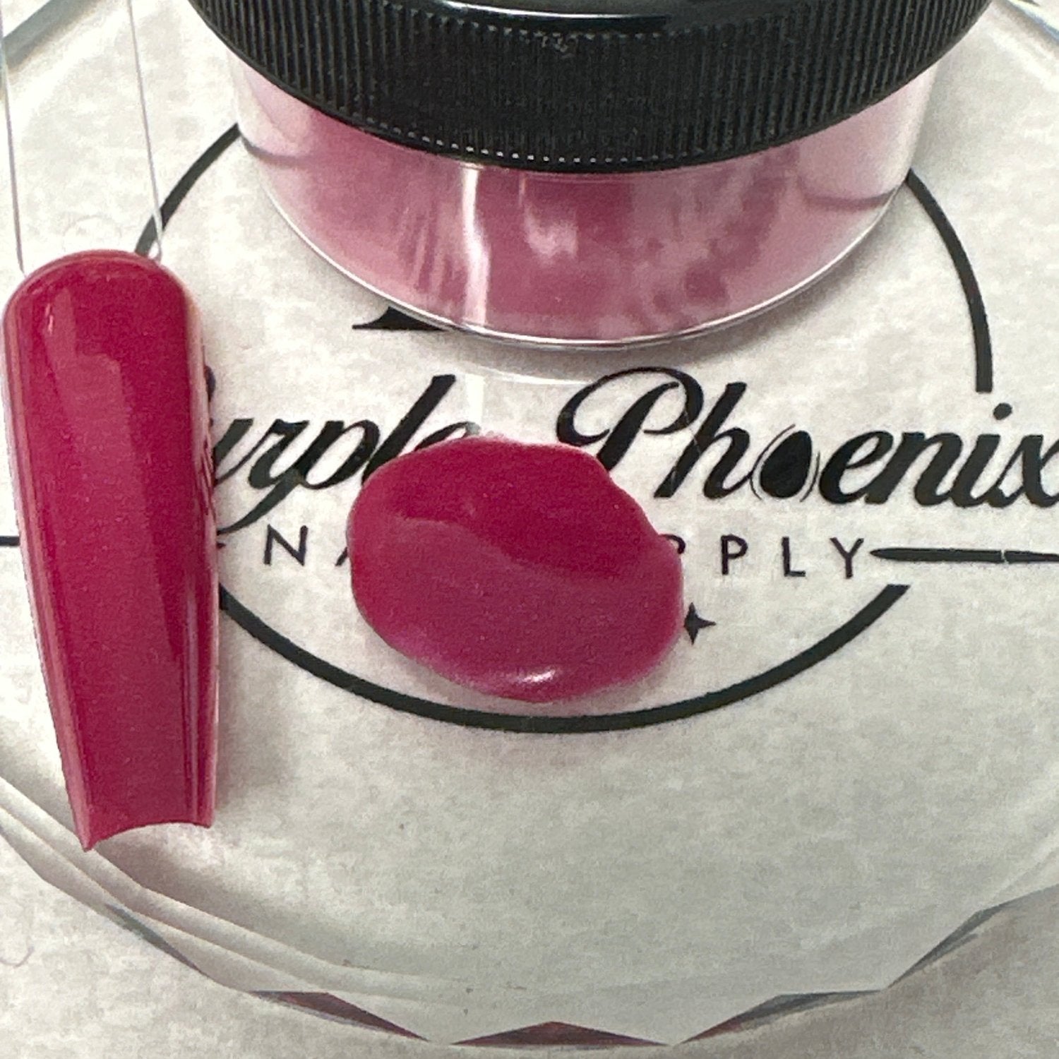 Swatch of Burgundy Bliss Acrylic Powder - a deep burgundy shade with a rich, velvety finish, applied on a nail tip, showcasing its luxurious and sophisticated color.