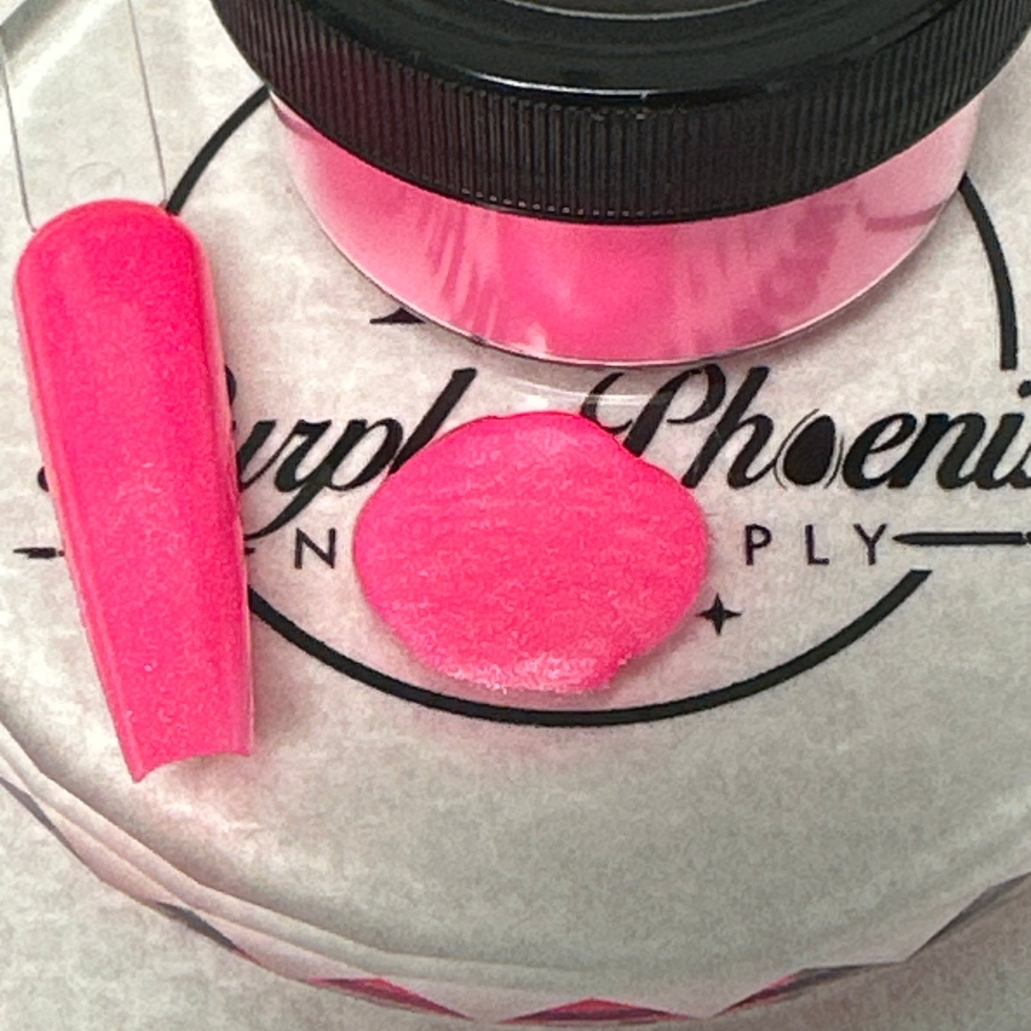 Swatch of Flashy Flamingo Acrylic Powder - a bold neon pink shade with a subtle shimmer, applied on a nail tip, showcasing its vibrant, eye-catching finish.