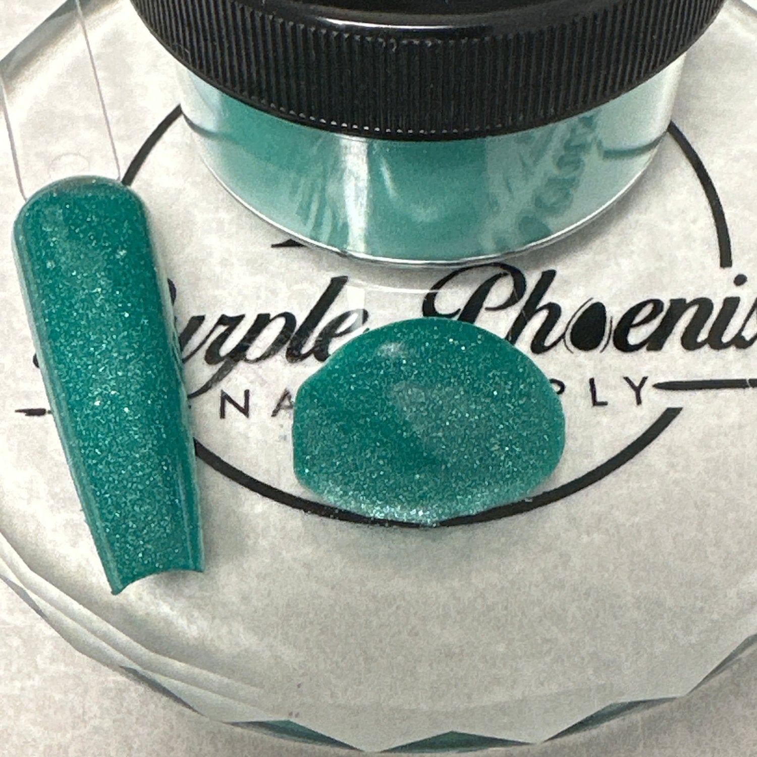 Close-up of Glowing Goblin Acrylic Powder - bright green with a glow-in-the-dark feature, applied on a nail tip, highlighting its striking and magical appearance.